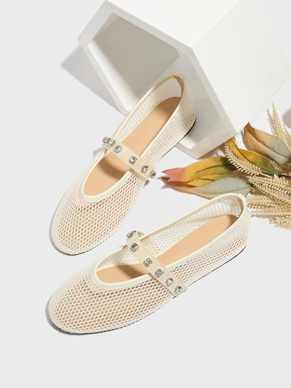 Beige mesh shoes with embellishments on a white background