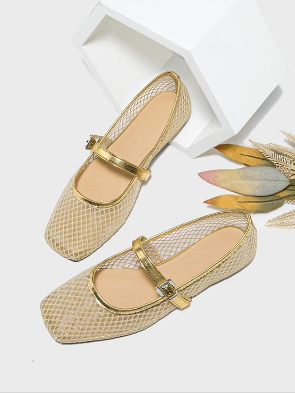 Gold mesh flats with a strap on a white background