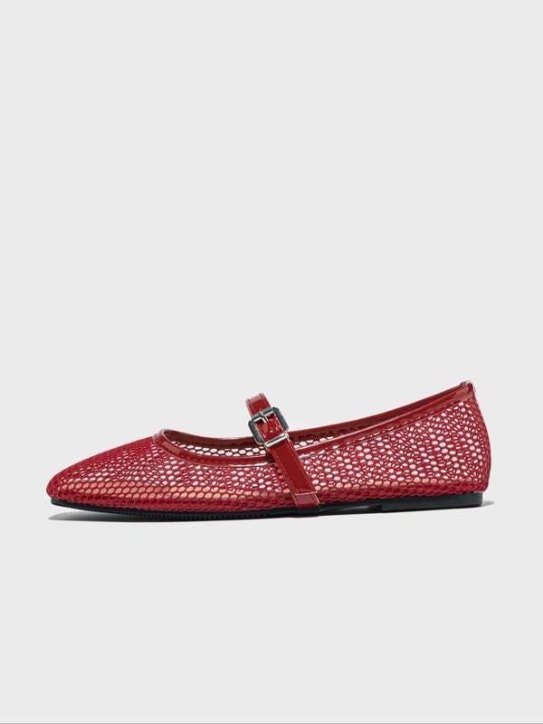 Red woven flat shoe with a strap on a light gray background