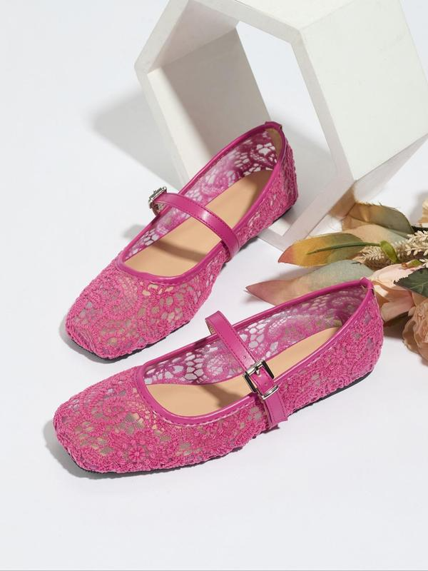 Pink lace shoes with a strap on a white background