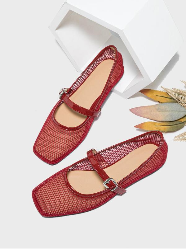 Red mesh shoes with a strap on a white background