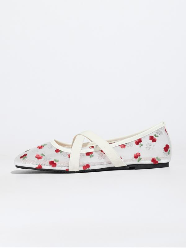 Floral-patterned flat shoe with white strap on a light gray background