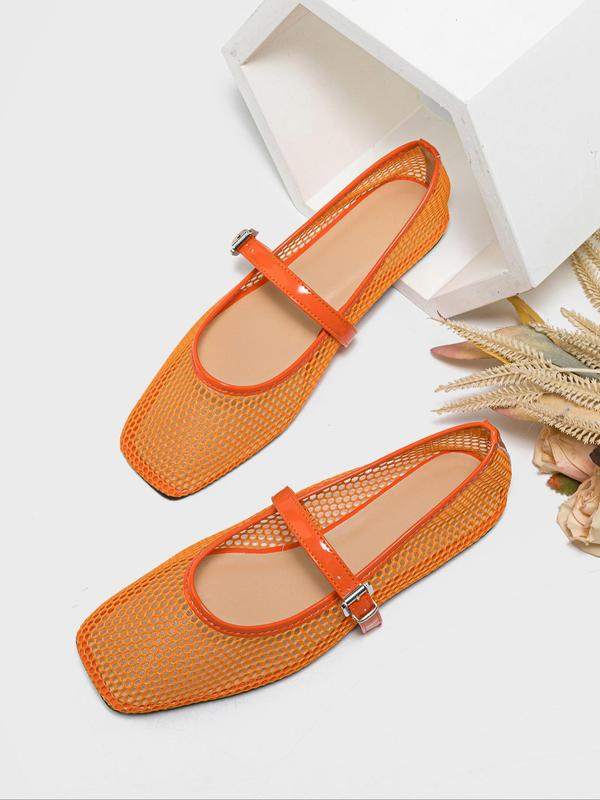 Orange mesh shoes with a strap on a white background